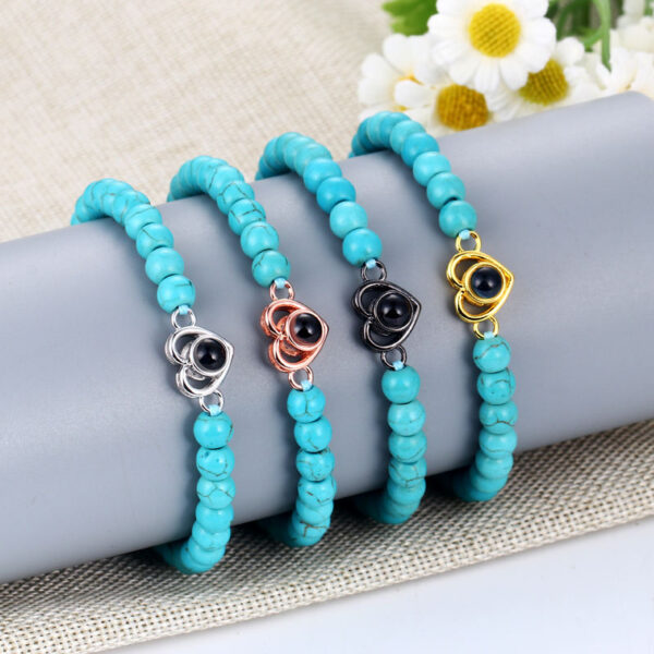 Pulsera de piedras con dije de corazón - Imagen 3